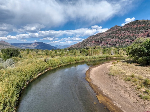 exterior space featuring a water and mountain view