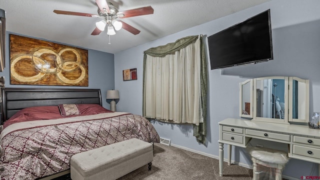 bedroom with visible vents, a ceiling fan, baseboards, and carpet floors