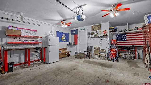 garage featuring a garage door opener and freestanding refrigerator