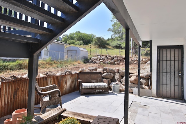 view of patio / terrace featuring a pergola and fence