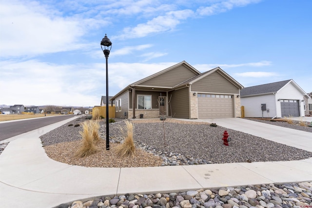 ranch-style home with brick siding, driveway, and a garage