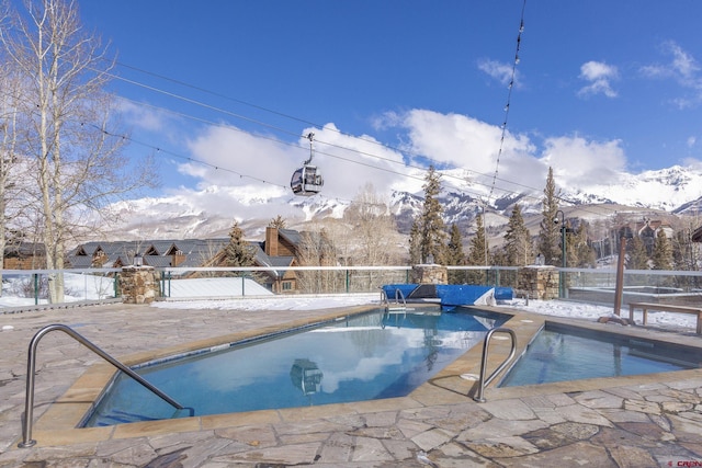 view of swimming pool featuring a fenced in pool, a patio, and fence