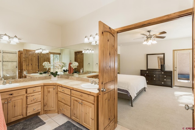 full bathroom with tile patterned flooring, double vanity, a ceiling fan, and a sink