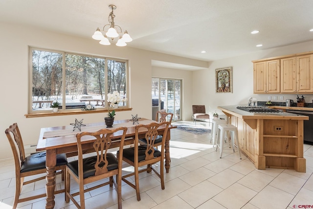 dining area with recessed lighting, a chandelier, and light tile patterned floors