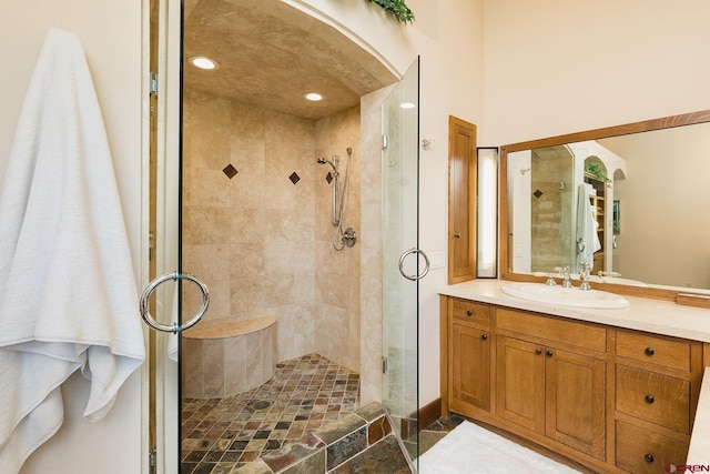 bathroom featuring vanity and a stall shower