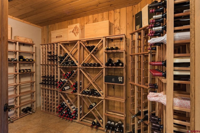 wine room featuring wooden walls and wooden ceiling