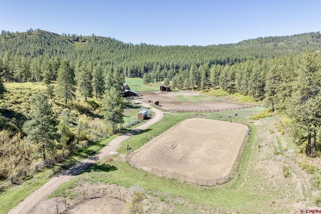 aerial view featuring a rural view and a forest view