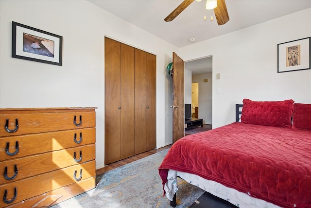 bedroom featuring wood finished floors, a closet, and ceiling fan