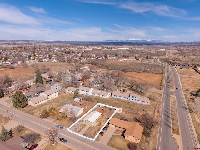 birds eye view of property featuring a mountain view