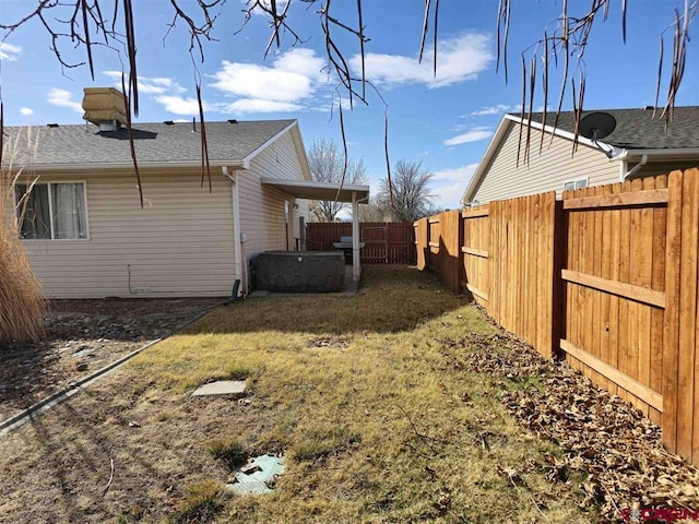 view of yard with a fenced backyard