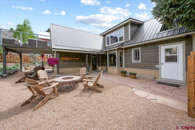 view of patio with a fire pit