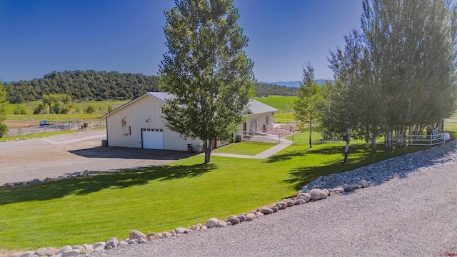 exterior space with driveway and a front lawn