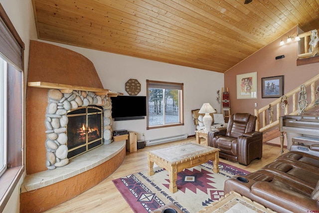 living room with a baseboard heating unit, lofted ceiling, wooden ceiling, a fireplace, and wood finished floors