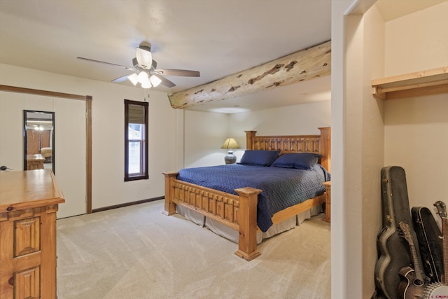 bedroom featuring a ceiling fan, light colored carpet, and baseboards