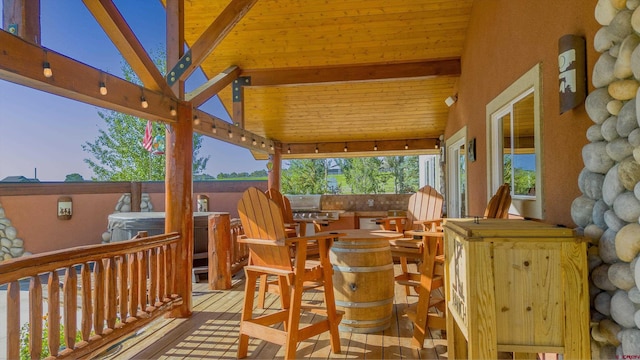 deck featuring a hot tub