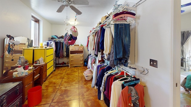 walk in closet featuring tile patterned flooring and ceiling fan