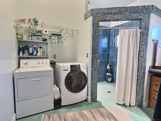 laundry room featuring washer and dryer and laundry area