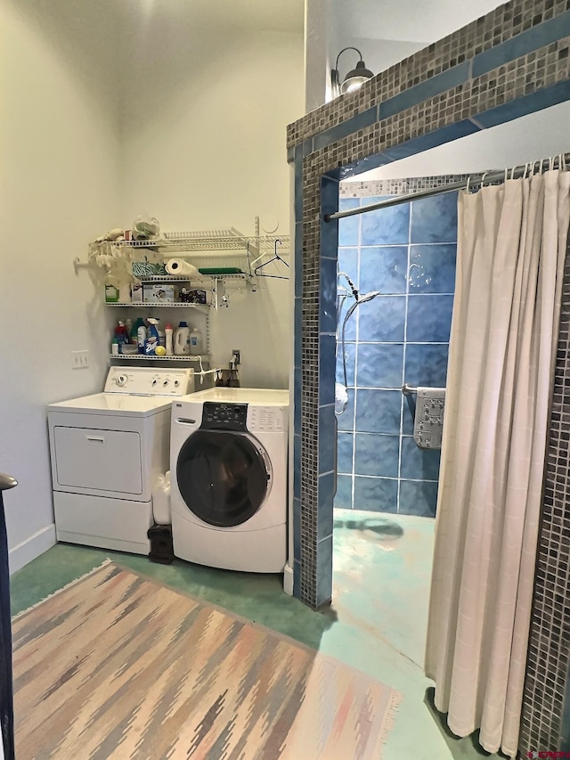 laundry room featuring washer and dryer, laundry area, and baseboards