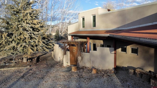 view of property exterior with stucco siding