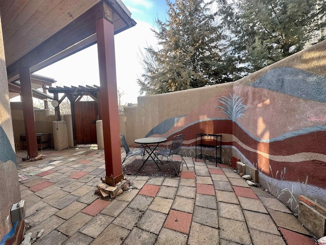 view of patio / terrace featuring fence and a pergola