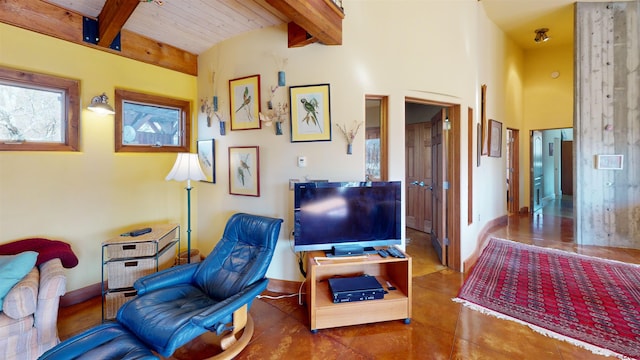 living room featuring beam ceiling and wood ceiling