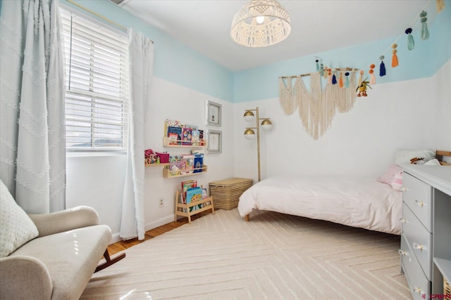 bedroom featuring baseboards