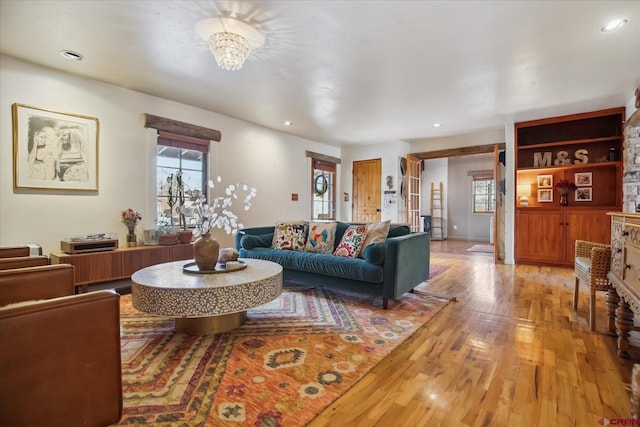 living area with plenty of natural light, recessed lighting, and light wood-type flooring