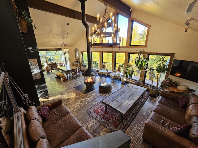 living room with beam ceiling, a notable chandelier, high vaulted ceiling, and wood finished floors