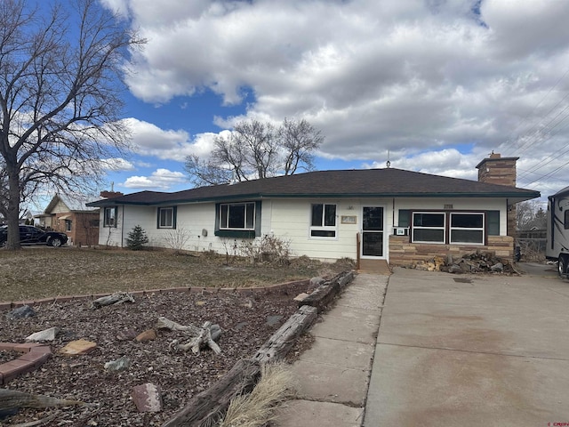 single story home with a chimney