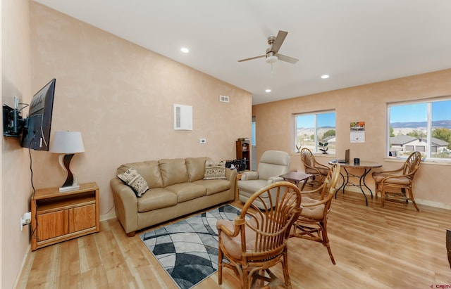 living area with recessed lighting, light wood-style flooring, baseboards, and ceiling fan