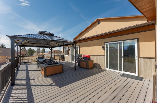 wooden deck featuring a gazebo