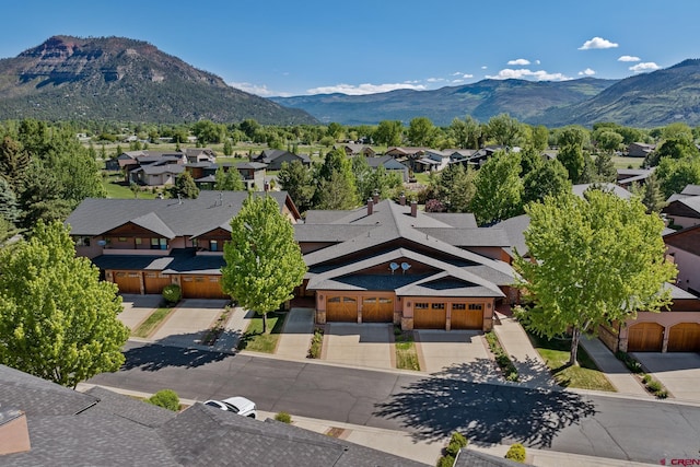 birds eye view of property featuring a mountain view and a residential view