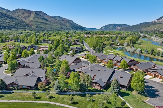 birds eye view of property featuring a residential view and a water and mountain view