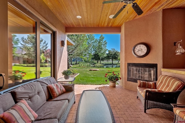 view of patio featuring an outdoor hangout area and ceiling fan