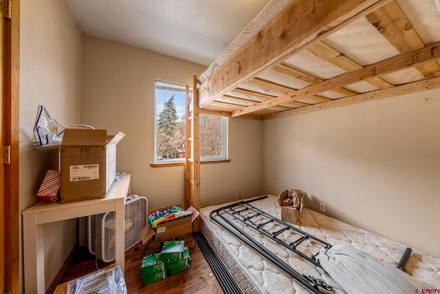 bedroom with wood-type flooring