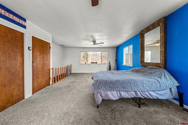 carpeted bedroom with a ceiling fan