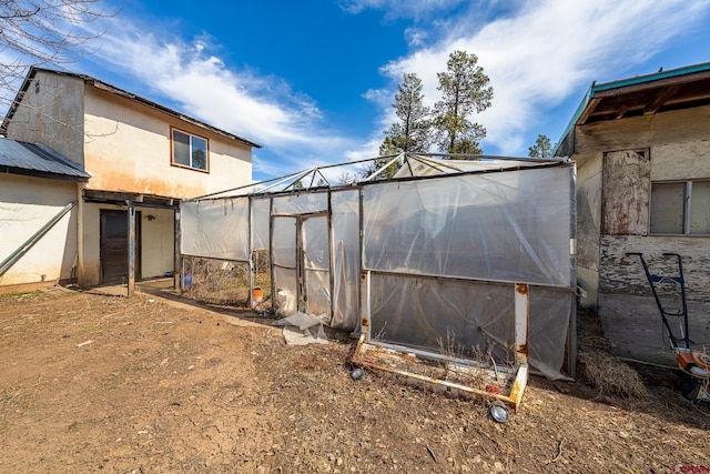 view of yard featuring an exterior structure and an outbuilding