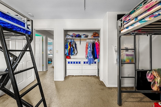 carpeted bedroom with a closet