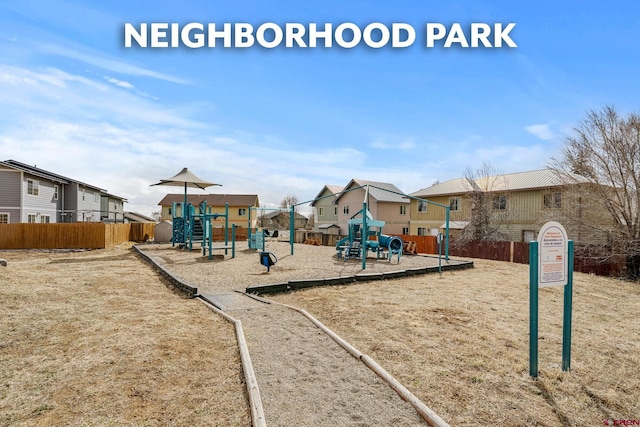 community jungle gym with fence and a residential view