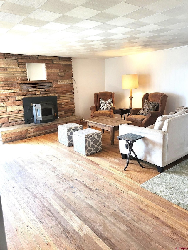 living area featuring a fireplace and hardwood / wood-style flooring