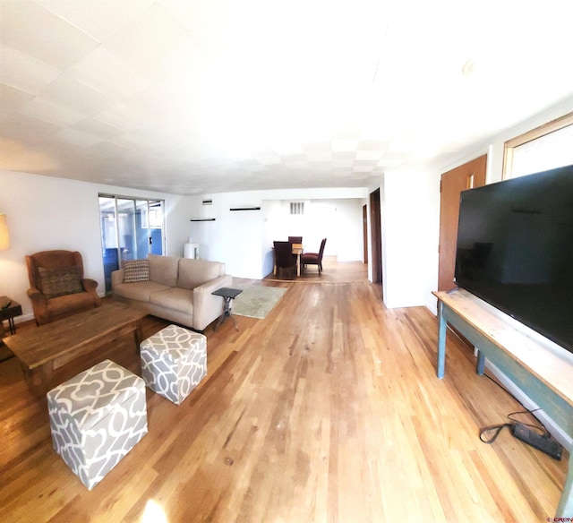 living area with wood finished floors