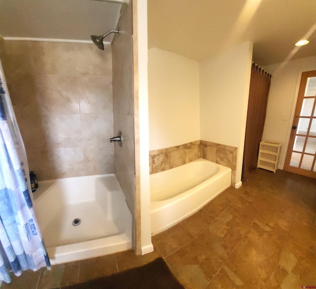 bathroom with curtained shower, a garden tub, and radiator heating unit