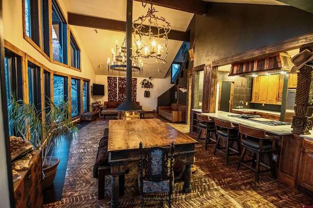 214 Mill Rd, Rico, CO 81332 - dining area featuring beamed ceiling, a chandelier, and high vaulted ceiling