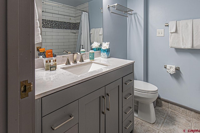 bathroom with toilet, curtained shower, tile patterned flooring, baseboards, and vanity