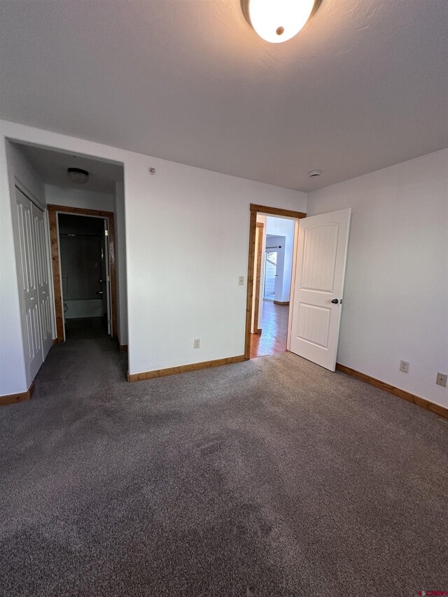 530 Redcliff Cir Unit F-203, Ridgway, CO 81432 - empty room featuring dark colored carpet and baseboards