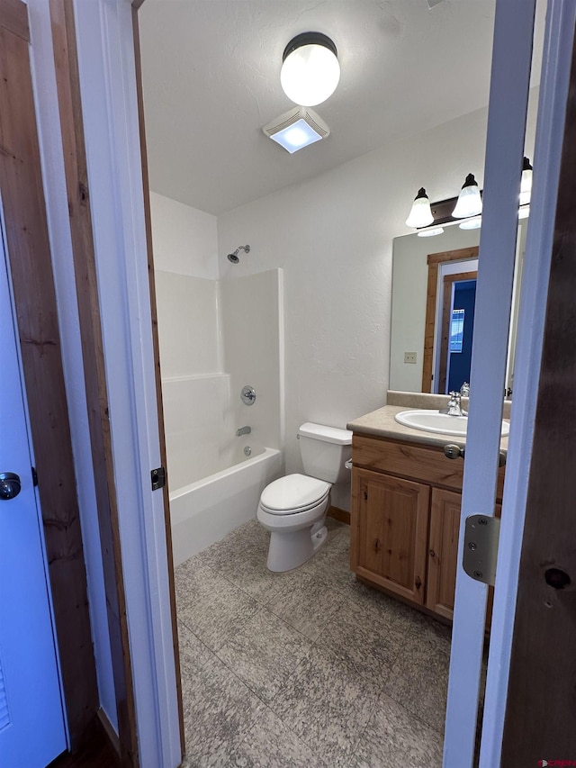 530 Redcliff Cir Unit F-203, Ridgway, CO 81432 - bathroom with vanity, toilet, and bathing tub / shower combination