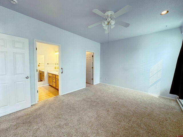 unfurnished bedroom featuring light carpet, recessed lighting, ensuite bath, and baseboards