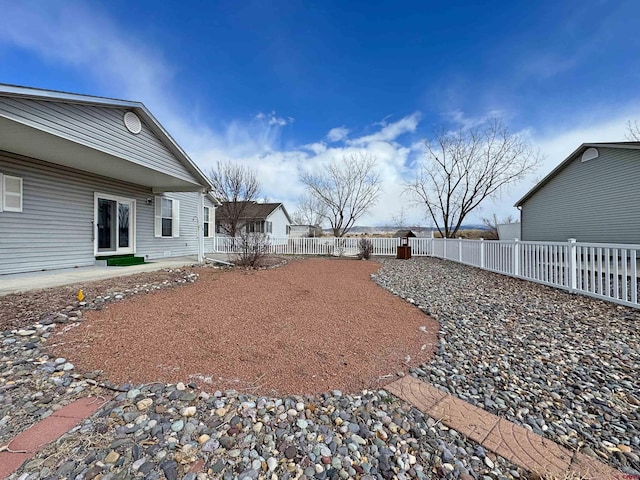 view of yard featuring a fenced backyard