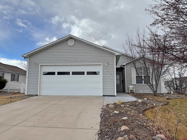 ranch-style home with an attached garage and driveway