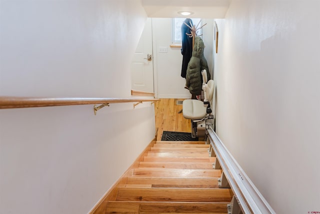 staircase featuring wood finished floors